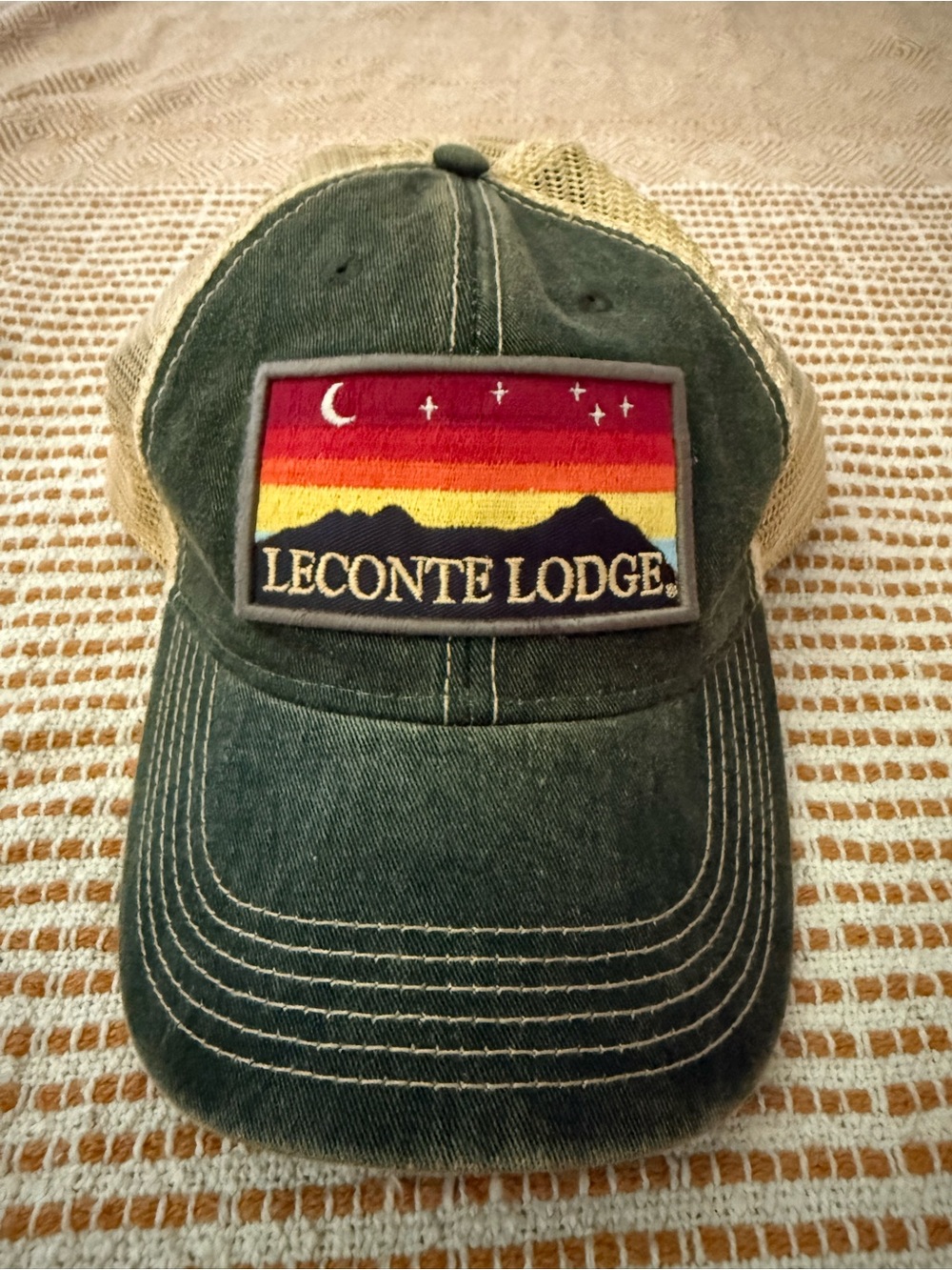 The Unisex LeConte Lodge green distressed Trucker Hat